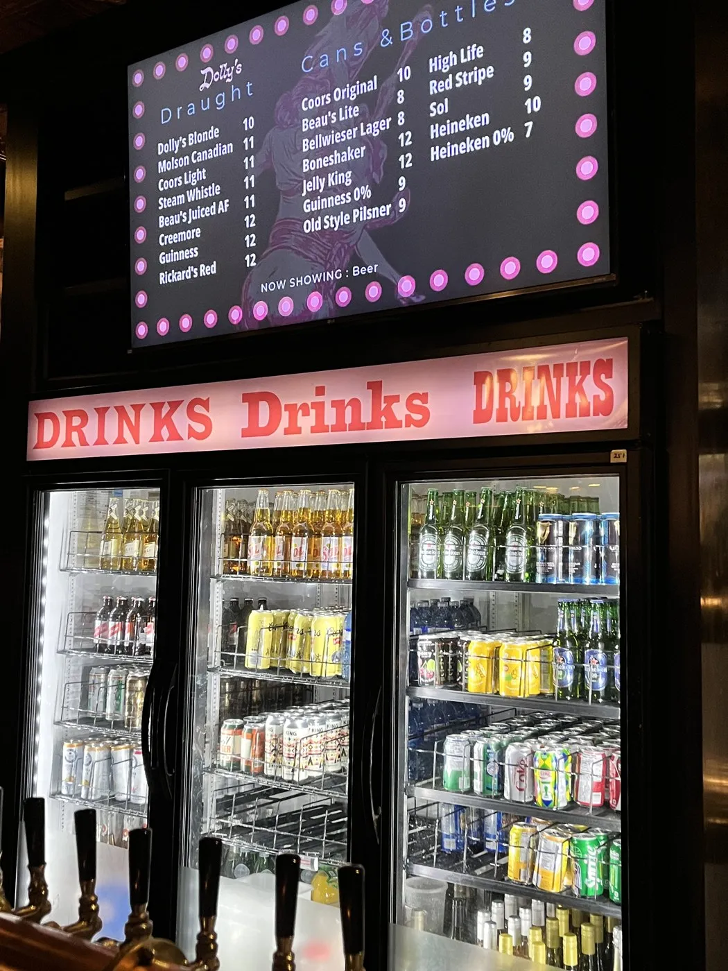 The drinks fridge under the neon